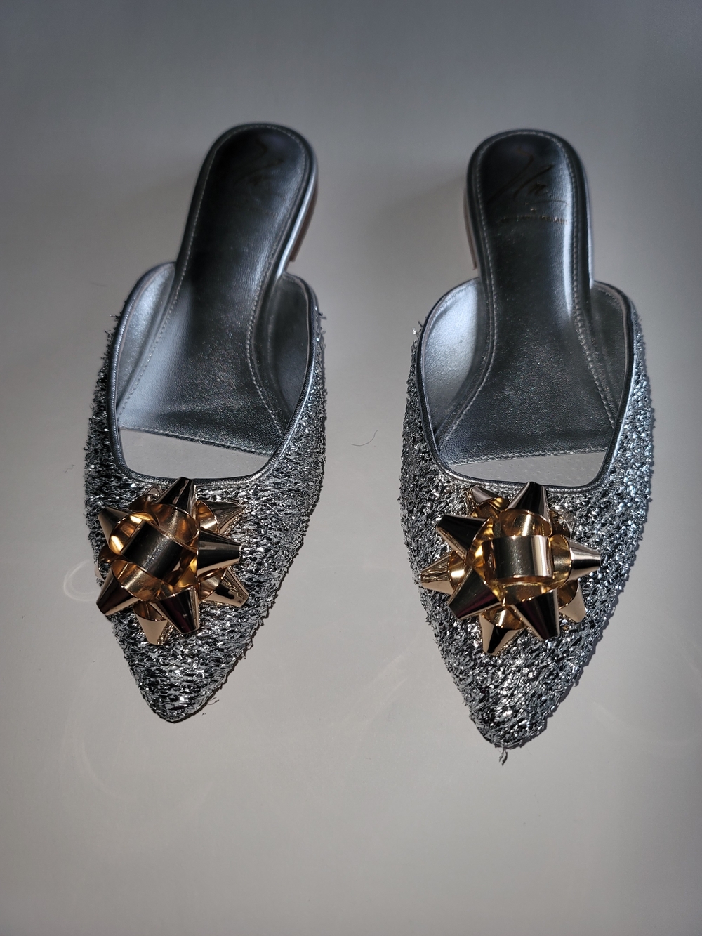 ANTONIO MELANI, THE NAT NOTE, Silver Sparkle Mules with Gold Bow Ornament